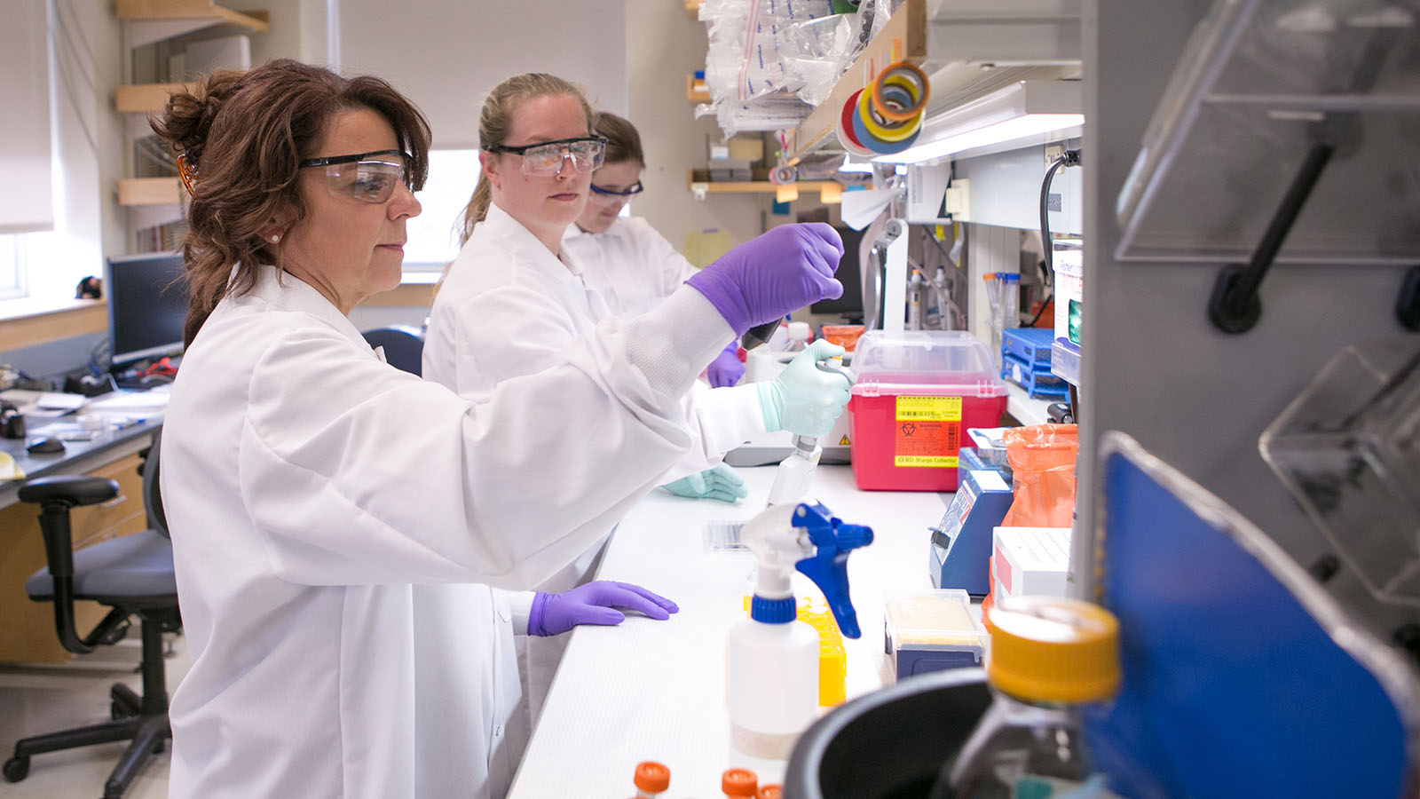 Cat Lutz (far left) in her lab at JAX