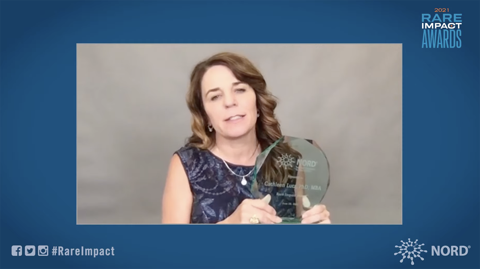 A screenshot of JAX researcher Cat Lutz accepting her rare disease research award in 2021