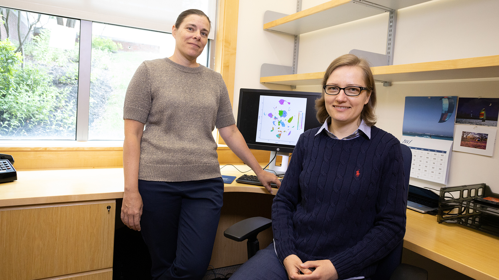 JAX's Catherine Kaczorowski and Maria Telpoukhovskaia in an office smiling for an informal portrait