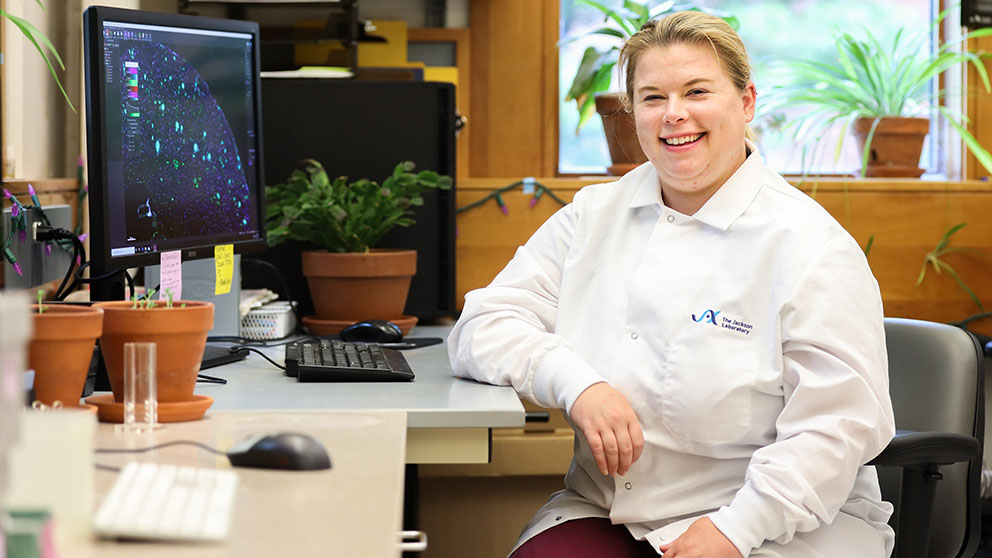 A photo of JAX's Kristen Onos in front of her computer. Photo credit: Tiffany Laufer