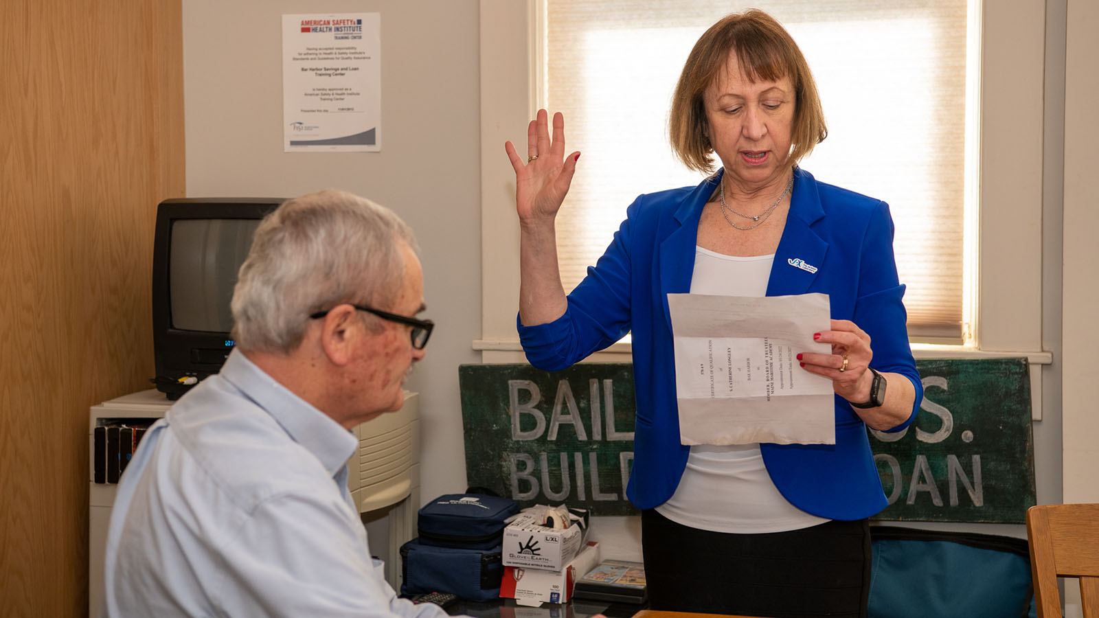 JAX employee Catherine 'Katy' Longley being sworn in. Dedimus Justice duties were performed by Bill Weir, president and CEO, Bar Harbor Savings and Loan.