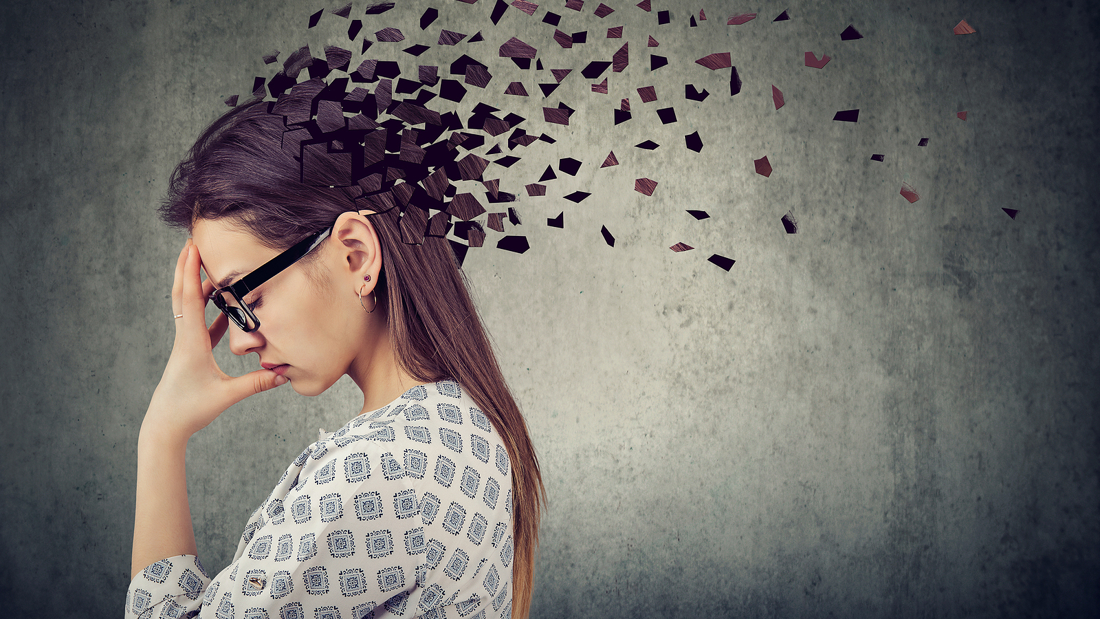 Stylized photo of a woman's head fracturing